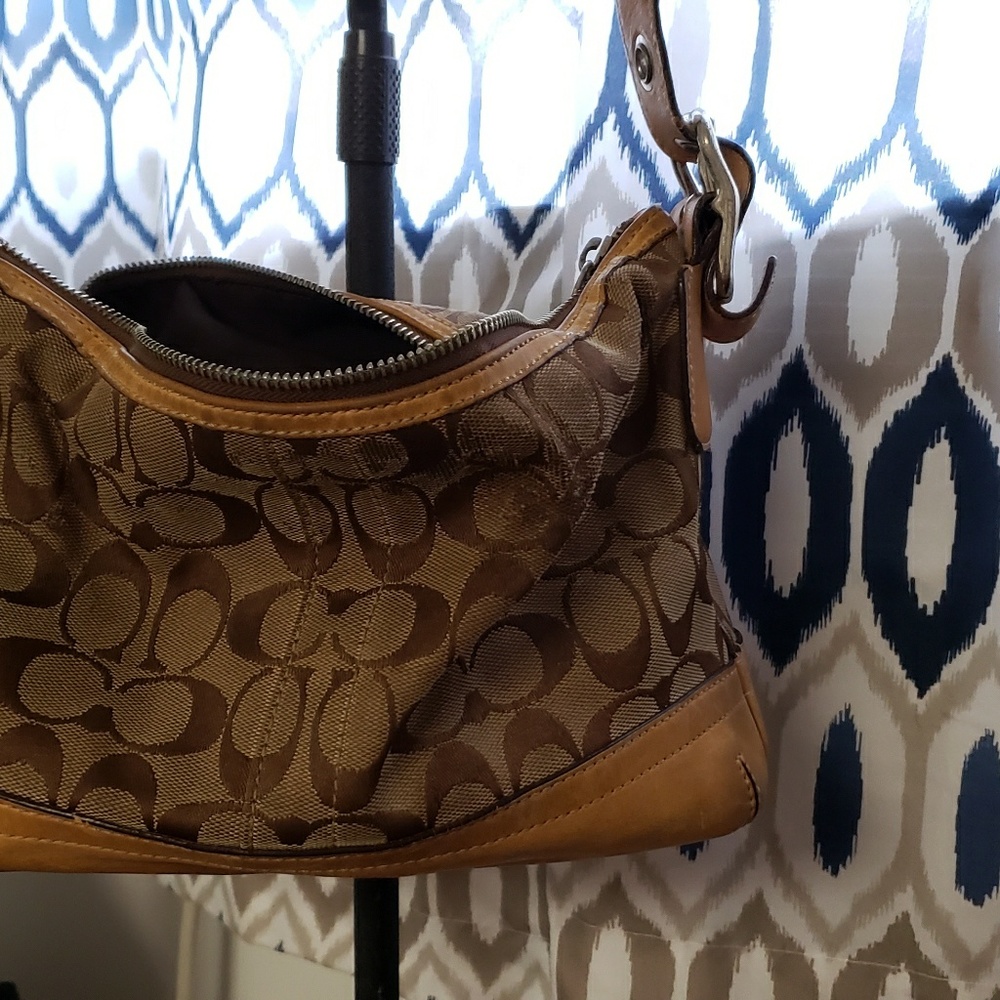 Coach handbag  leather handles and base